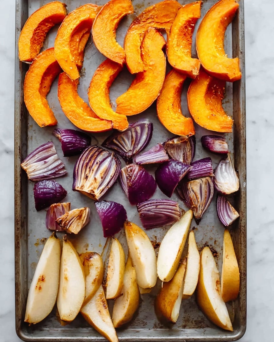 The image shows a baking tray with three groups of roasted vegetables arranged in layers. At the top, large crescent-shaped pumpkin slices have a bright orange color with slightly browned edges and soft texture. Below the pumpkin, there are irregular chunks of roasted purple onion, showing a mix of deep purple and golden brown with a slightly crisp look. At the bottom, there are wedge-shaped roasted pear slices in light tan with some browned spots on the skin and soft flesh. The tray is placed on a white marbled surface. photo taken with an iphone --ar 4:5 --v 7