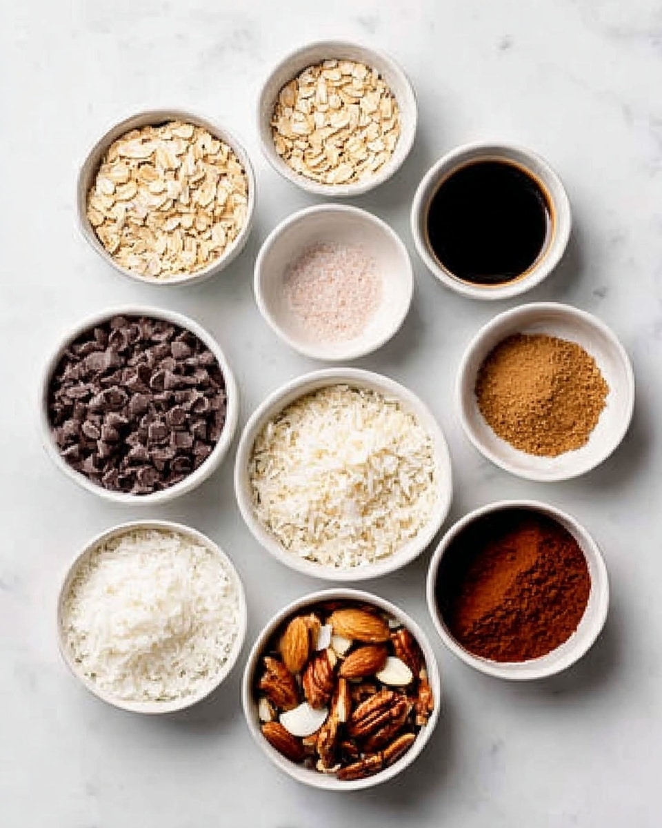 The image shows nine white bowls arranged in a loose circle on a white marbled surface. Each bowl contains a different ingredient: the top bowl holds light beige rolled oats; to its right, there's a dark liquid, likely syrup, in a small container; next is a small bowl with salt, light pink in color; below it is a white bowl filled with white rice flakes; the bottom right bowl has a dark reddish-brown powder; next is a similar white bowl with a cinnamon-colored powder; above it is a bowl filled with dark chocolate chips; above that is a bowl with mixed nuts, including almonds and pecans; and finally, to the left is a bowl with white coconut flakes. The overall color palette includes light creams, browns, dark chocolates, and white, with clear textures showing grains, powders, and nuts. Photo taken with an iphone --ar 4:5 --v 7