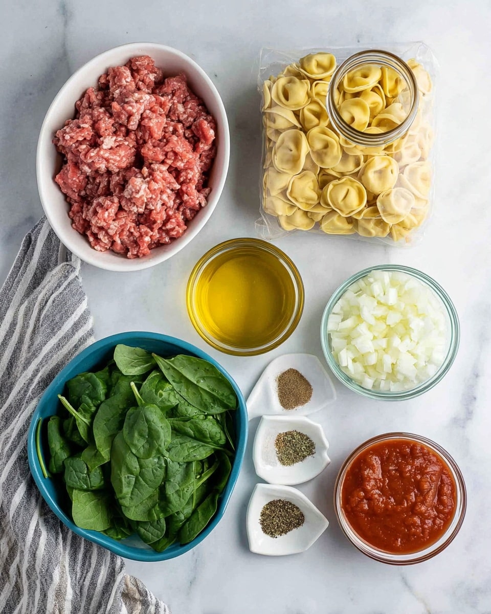 The image shows ingredients for a meal arranged on a white marbled surface. There is a white oval bowl filled with raw ground meat that is red with light pink fat pieces. Next to it, a large clear jar contains a light brown broth. A clear plastic pack holds pale yellow tortellini pasta. A small round glass bowl with golden olive oil is in the center. A blue glass bowl is filled with fresh dark green spinach leaves with visible veins. A small white triangular dish contains different dry spices in separate sections: light brown, black pepper, dried green herbs, and white salt. Near the bottom, a small glass bowl contains chunky dark red tomato sauce. A striped grey and white cloth napkin lies near a glass bowl filled with chopped white onions. Photo taken with an iphone --ar 4:5 --v 7