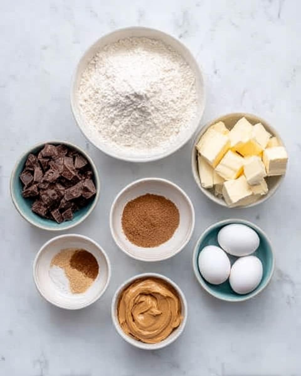 The image shows seven white bowls placed on a white marbled surface. The largest white bowl at the top center holds white flour with a fine texture. Below it, a slightly smaller white bowl filled with dark brown chocolate chunks sits in the middle. To the right of the chocolate chunks bowl is a white bowl with white granulated sugar. At the far right, a white bowl contains several pale yellow butter pieces. The bottom left has a small white bowl with a light brown powder, possibly cinnamon or another spice. In the center bottom, there is a white bowl holding two white eggs. To the bottom right, a white bowl contains a smooth pasty light brown ingredient, likely peanut butter. The bowls are arranged in a semi-circle on the white marbled surface. photo taken with an iphone --ar 4:5 --v 7