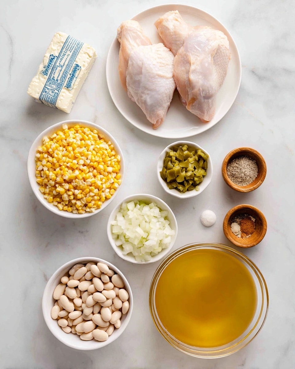 The image shows ingredients neatly placed on a white marbled surface. At the center top, two raw chicken pieces lie on a white plate. To the right of the chicken, there is a wrapped block of cream cheese with blue text. Below that, small white bowls hold chopped onions and green chopped pickles. Further down, a white bowl is filled with bright yellow corn kernels. To the left of the corn, a clear glass bowl holds white beans, and directly below that, another white bowl contains larger pale beans. At the bottom right, a large clear glass bowl is filled with golden broth. There are also two small wooden bowls, one with a mix of salt and ground pepper, and the other filled with a brown spice. The arrangement is orderly and visually clean, photo taken with an iphone --ar 4:5 --v 7