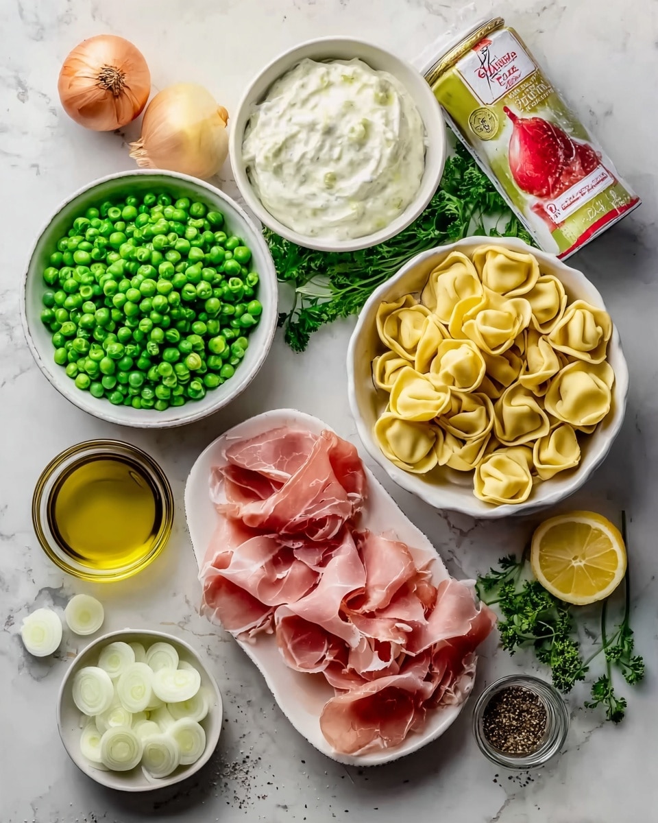 The image shows several white bowls and plates on a white marbled surface. One white bowl is full of bright green peas, and another white bowl contains pale yellow tortellini pasta. There is a white dish with a creamy white sauce in the center. Another white plate holds thin slices of pink prosciutto with white fat. A small white bowl has white onion slices. Around the bowls are a wedge of light yellow cheese, a whole yellow lemon, a brown shallot, a bunch of green parsley, a glass bowl with golden olive oil, and a red and white container of seasoning. Photo taken with an iphone --ar 4:5 --v 7