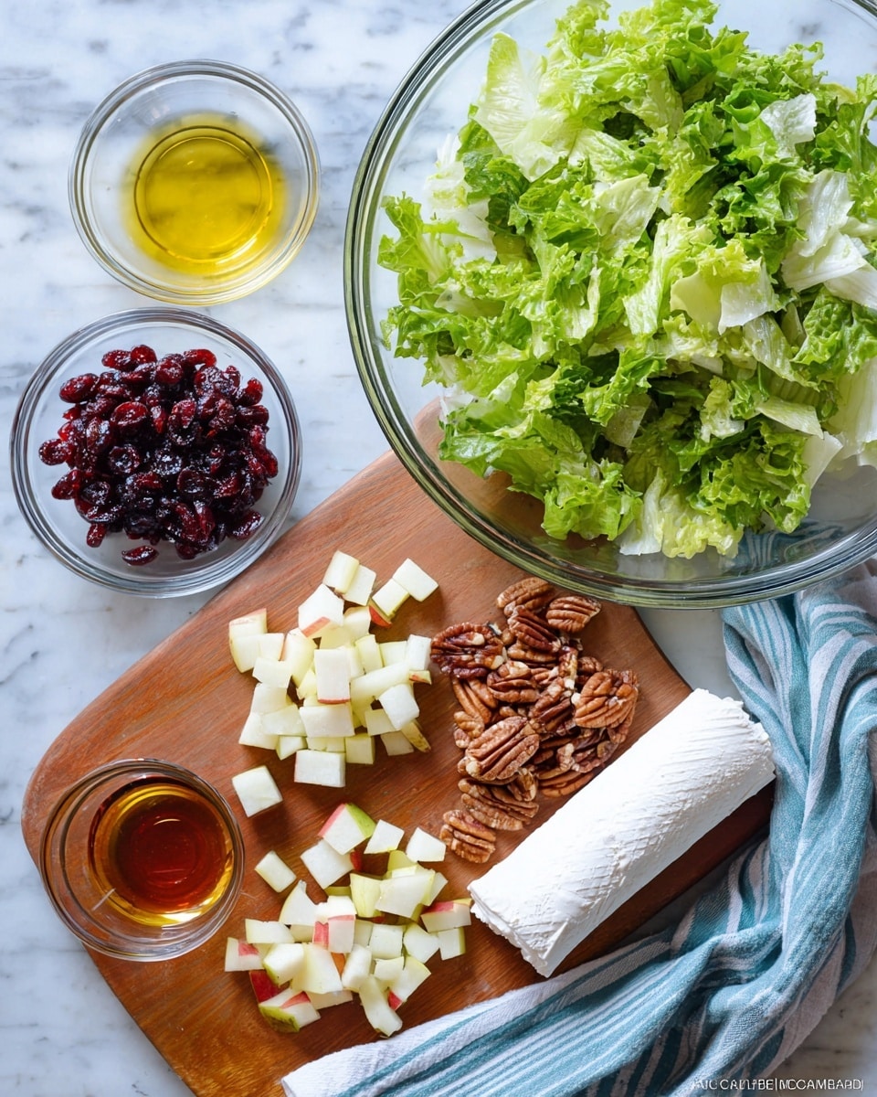 The image shows fresh green chopped lettuce leaves in a large clear glass bowl on the upper right side. Below and to the left, there are small piles of diced red-skinned pear pieces, a rolled log of white goat cheese, and a group of whole pecans. Above the cheese, there are two small clear glass bowls, one filled with golden olive oil and the other with dark amber maple syrup. At the top left corner, a heap of dark red dried cranberries is present. The items are arranged on a wooden board with a blue and white striped cloth on the right side, all placed on a white marbled surface photo taken with an iphone --ar 4:5 --v 7