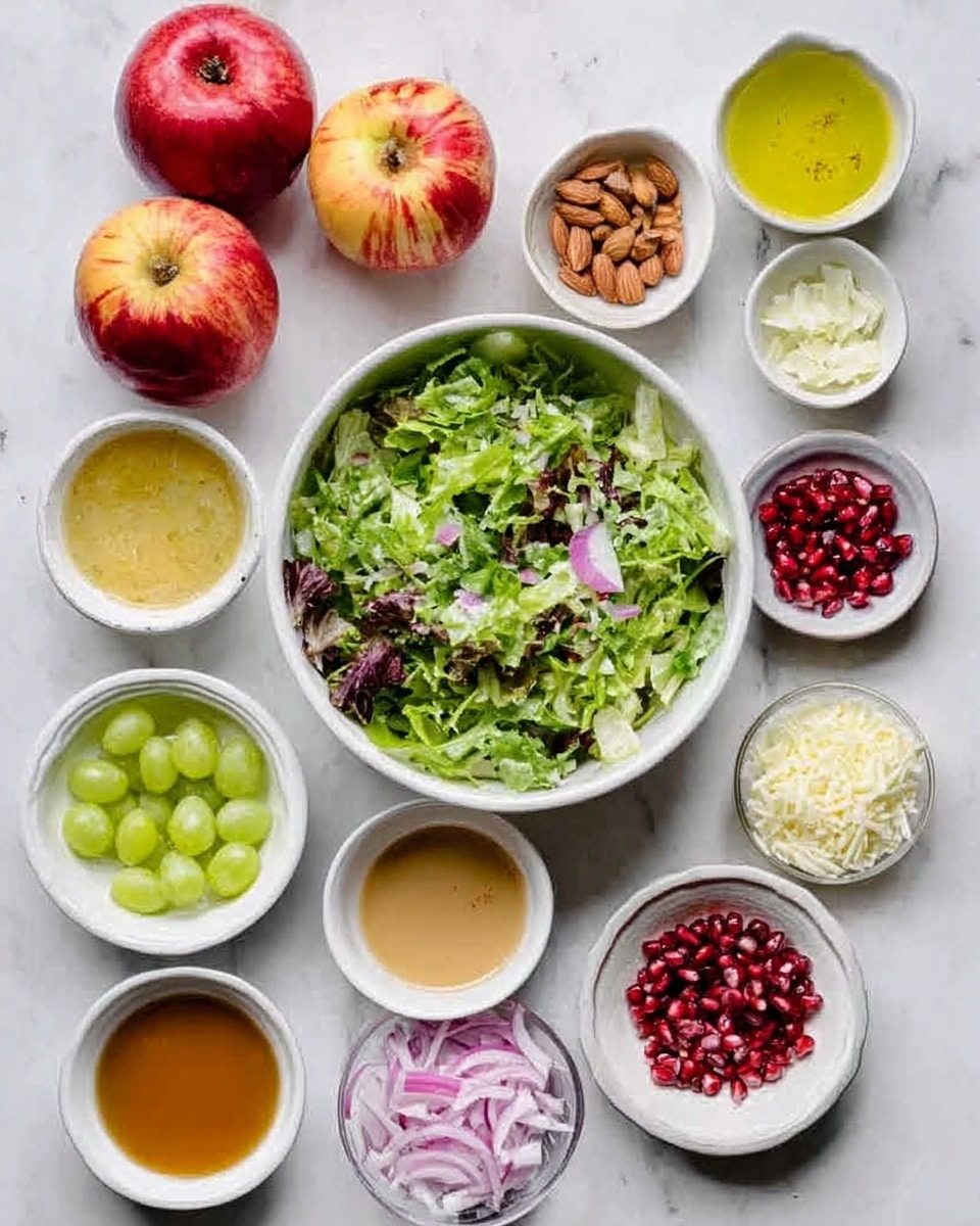 The image shows a white marbled surface with various small white bowls and two whole apples arranged neatly. In the center, a large white bowl is filled with mixed green salad leaves, layered with different shades of green and some purple. Around it, there are small white bowls with different ingredients: one contains sliced green grapes, another pomegranate seeds, another chopped red onions, and two have finely shredded cheese and sliced almonds. There are also bowls with different dressings in light brown, golden yellow, light green, pink, and white colors. Two whole apples with red and yellow skin are on the top left. The image is bright and clean with a fresh and colorful appearance. Photo taken with an iphone --ar 4:5 --v 7