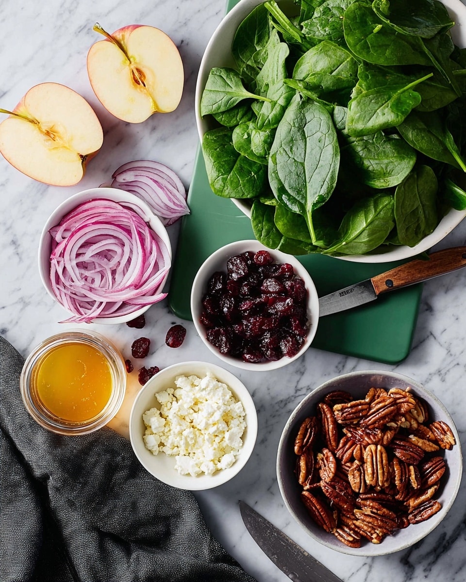 The image shows a white bowl filled with a mix of fresh green leafy salad at the center, with textures of lettuce and spinach leaves visible and different shades of green. Around the bowl, there are small white bowls and plates placed on a white marbled surface, each containing ingredients for the salad: chopped walnuts in one bowl, honey in another, a mixture of white crumbled cheese, dried red cranberries, and more cheese with blue veins. There are whole fruits, including a red pomegranate and a yellow pear, placed near the bowls for decoration. A woman's hand is reaching in from the left side holding a wooden spoon over some walnuts. The setting is bright and clean, emphasizing fresh ingredients. Photo taken with an iphone --ar 4:5 --v 7