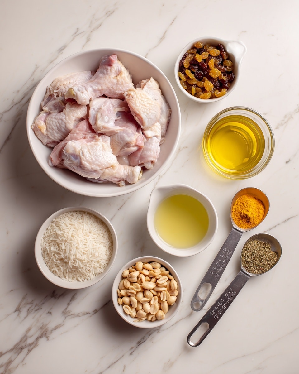 The image shows several ingredients arranged on a white marbled surface. In the center, there is a white bowl filled with raw boneless, skinless chicken pieces. Surrounding it are six measuring cups and small white bowls: one with golden brown raisins, one with clear light yellow broth in a glass measuring cup, one with light greenish-yellow oil in a white bowl, one with a mixed brown and greenish spice blend in a white bowl, one with white uncooked rice in a metal measuring cup, one with whole peanuts in a smaller metal measuring cup, and two metal measuring spoons holding bright yellow and orange spices. All items are neatly spaced, showing a clean setup for cooking. Photo taken with an iphone --ar 4:5 --v 7