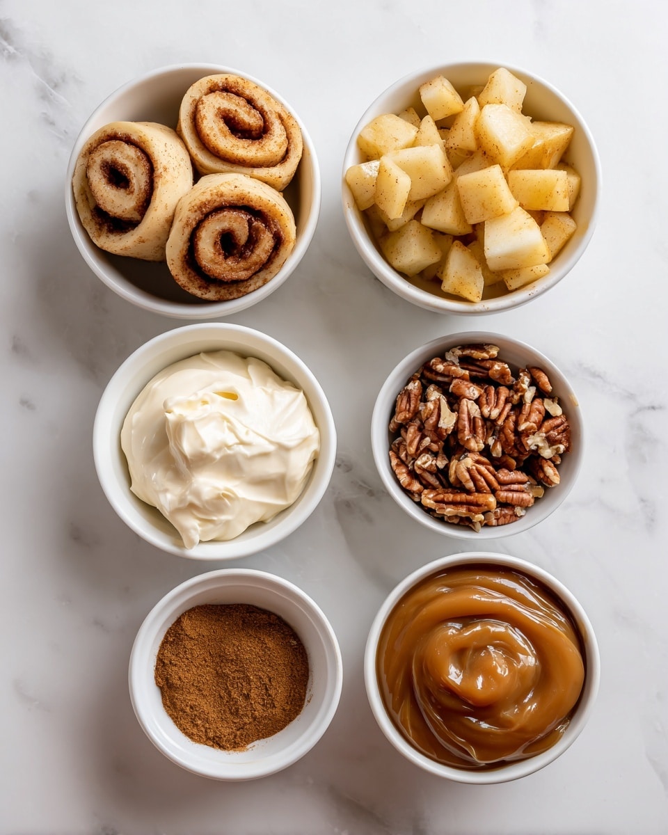 The image shows six small white bowls arranged on a white marbled surface. The top row has four bowls: the first bowl on the left contains light brown cinnamon roll slices with a spiral shape, the second bowl holds a small amount of thick white cream, the third bowl is filled with chunky golden apple pieces in a glossy sauce, and the fourth bowl contains small chopped brown pecan nuts. On the bottom row, three small bowls sit: the one on the left holds a fine brown cinnamon powder, the middle bowl contains a thick, smooth caramel sauce with a shiny texture, and the bowl on the right also has a glossy caramel sauce but appears slightly thinner. All the items are neatly arranged and clearly visible. Photo taken with an iphone --ar 4:5 --v 7