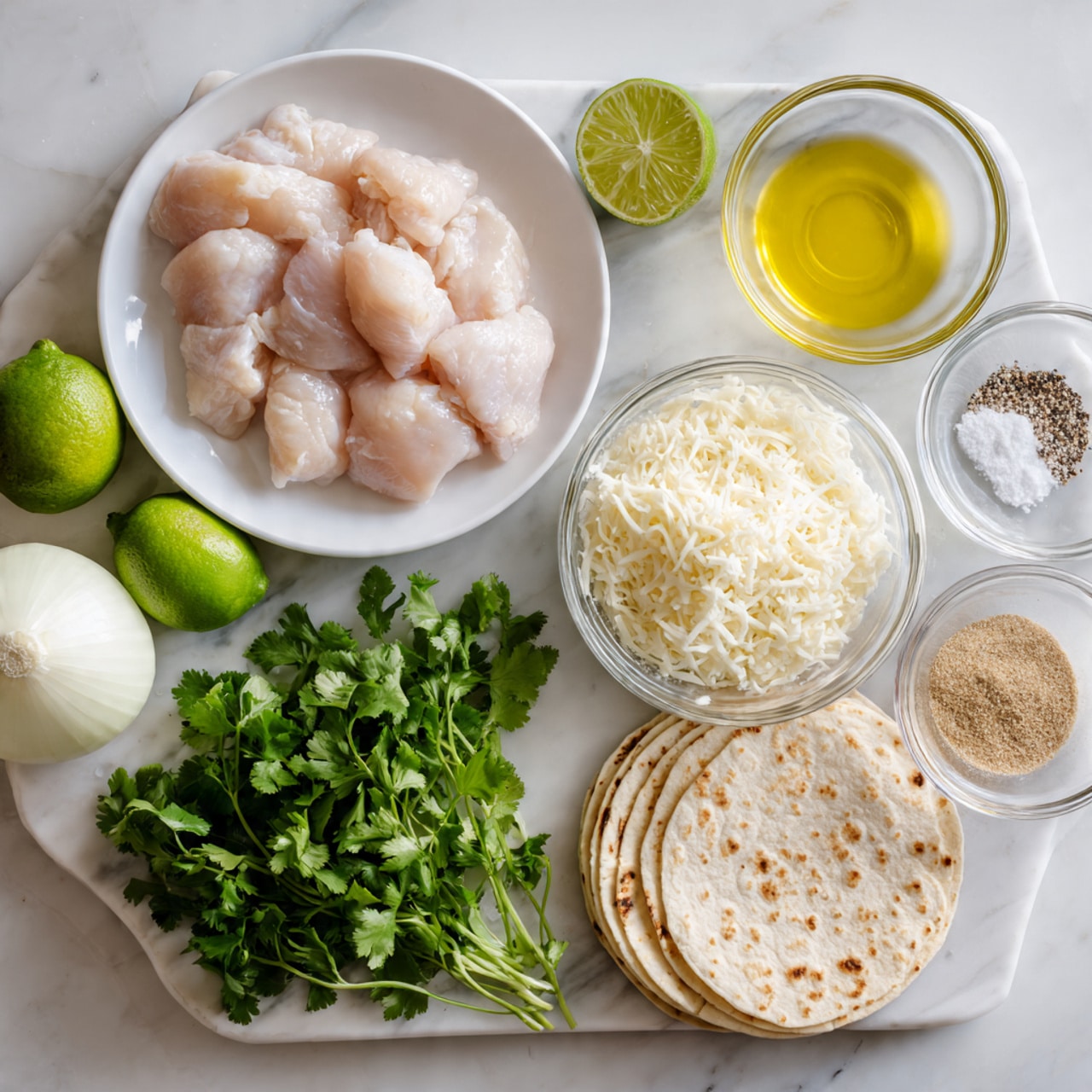The image shows raw chicken pieces placed on a white plate to the left, a whole lime and a white onion sit side by side nearby. In the middle, a small glass bowl is filled with finely shredded white cheese; next to it is another small glass container with yellow cooking oil. To the right, a stack of flat round white tortillas is beside a bunch of fresh green cilantro. Around these main items, there are three small glass bowls each holding different spices—one with a mix of salt and black pepper, one with plain salt, and one with a light brown powder. All items are arranged neatly on a white marbled surface photo taken with an iphone --ar 4:5 --v 7