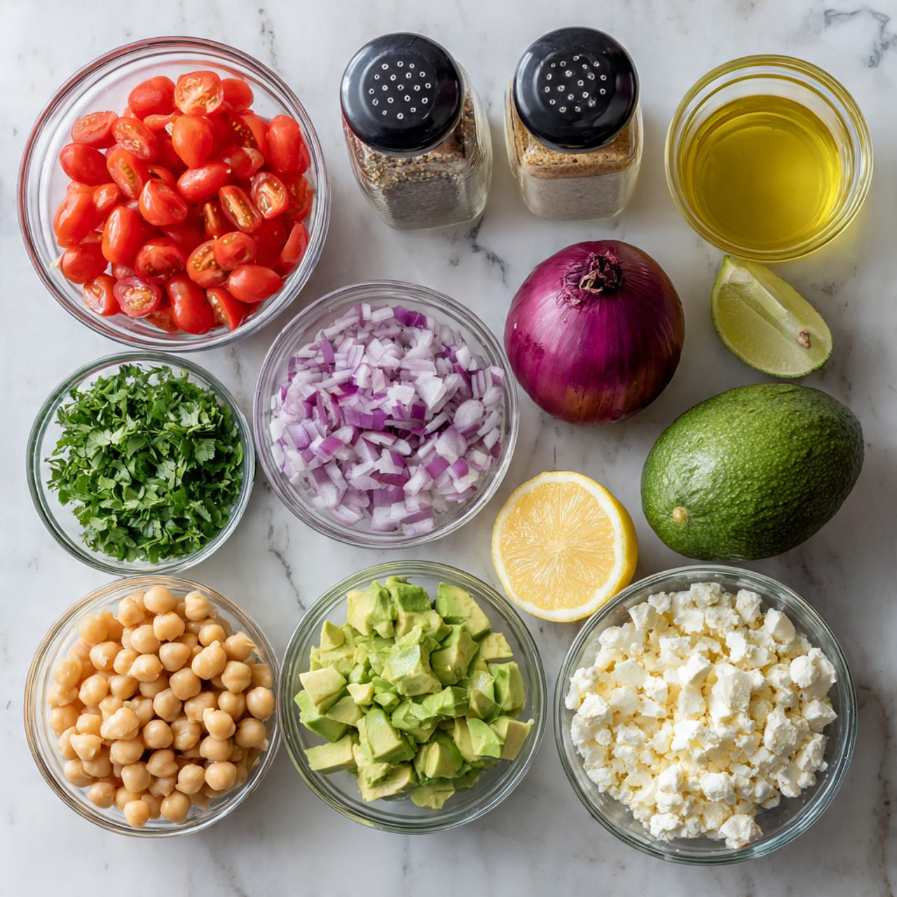 The image shows ingredients for a fresh salad laid out neatly on a white marbled surface. There are small clear bowls filled with bright red cherry tomatoes, light beige chickpeas, finely chopped red onion, light green chopped cilantro, creamy white chopped cheese, and light green avocado slices. Next to the bowls, there is one whole purple onion and one dark green whole avocado. In the back, there are two black-topped spice jars, a glass bottle with light yellow olive oil, half a lemon, and a cup with pale yellow lemon juice. The colors are bright and fresh, creating a clean and inviting look. Photo taken with an iphone --ar 4:5 --v 7