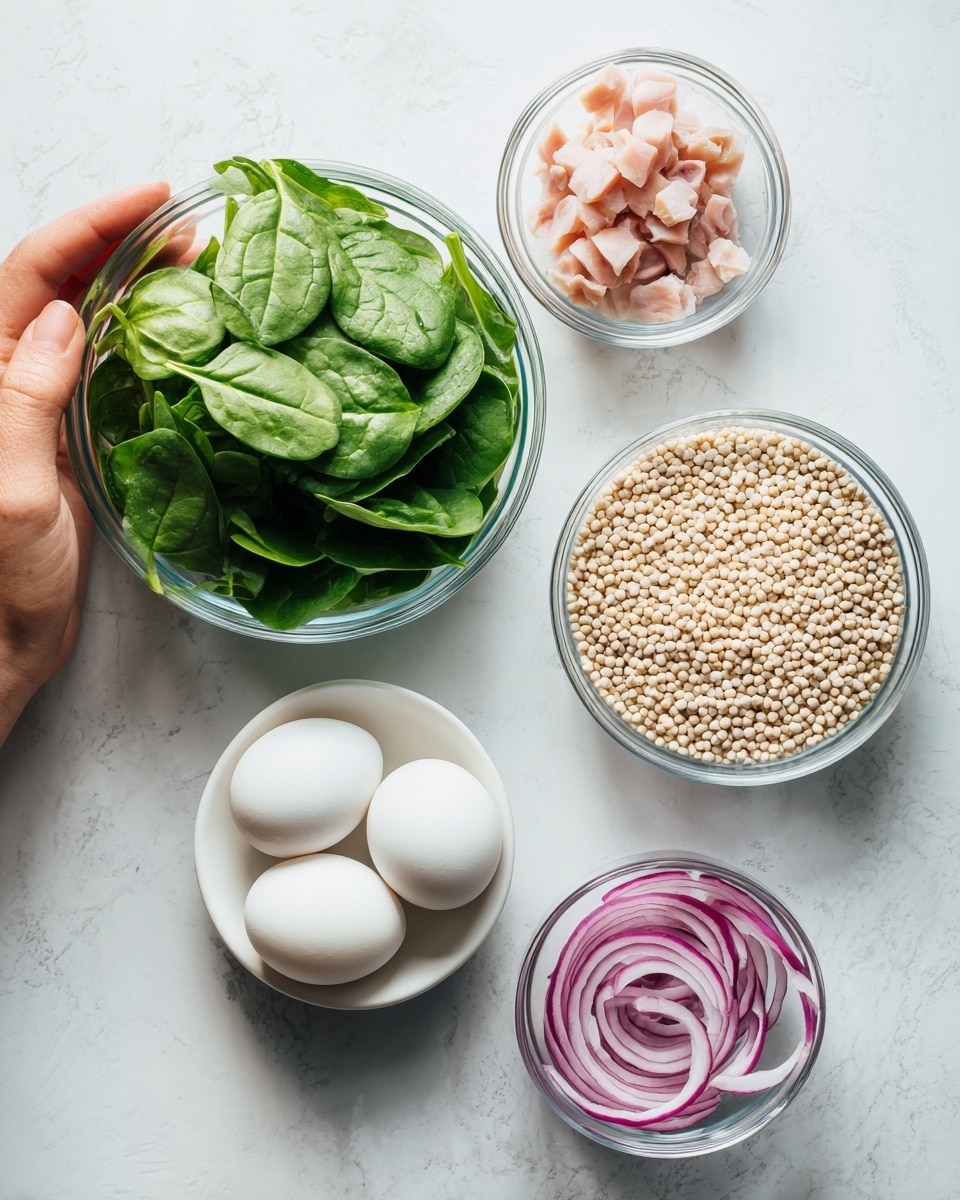 The image shows a white marbled surface with five clear glass bowls arranged neatly. The largest bowl holds fresh green spinach leaves, showing a smooth and leafy texture. To the right of it, a medium bowl is filled with tiny light beige grains, which look dry and round. Above and to the right of the grains, another bowl contains small pieces of pale pink and white sliced meat, with a slightly chunky texture. Below the spinach, in the center, is a small white bowl with two plain white eggs lying side by side, smooth and round. Finally, to the far right is a tiny bowl with thin slices of bright purple-red onions, showing a translucent, slightly wet texture. A woman's hand is not visible but implied for interaction. The background is a smooth white marbled texture. photo taken with an iphone --ar 4:5 --v 7