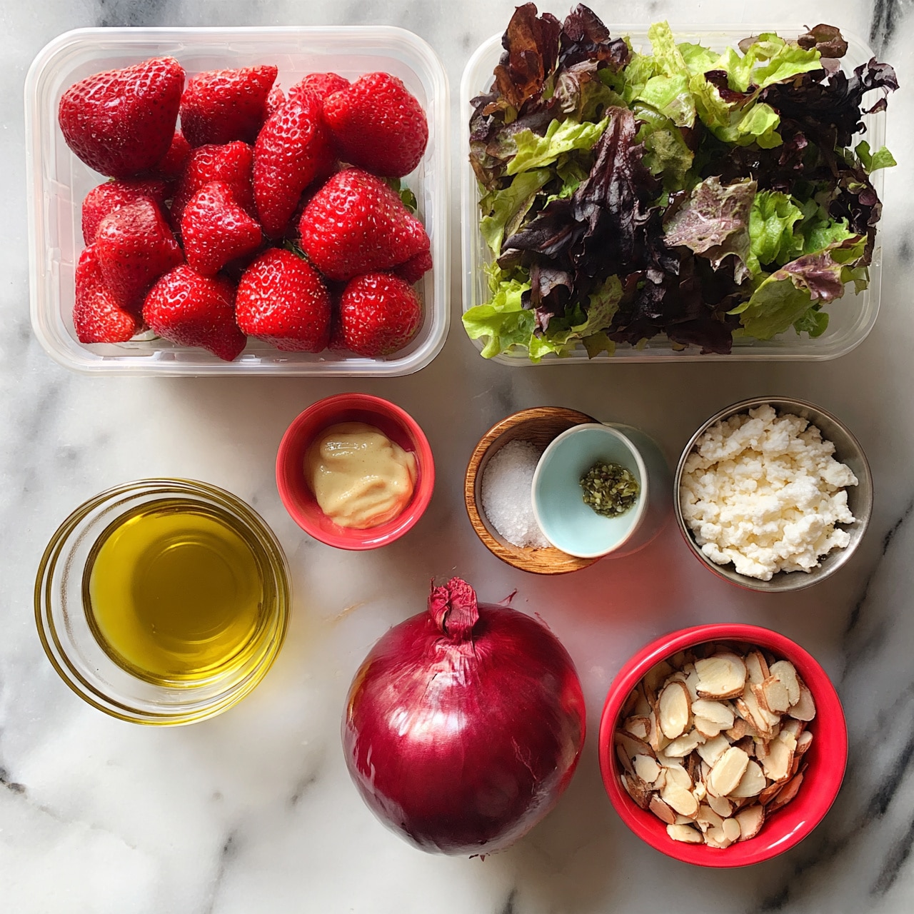 square image The image shows a flat lay of fresh ingredients arranged on a white marbled surface. At the top left, there is a clear plastic csquare imageontainer filled with bright red strawberries, and to its right, another clear plastic container holding mixed green and dark purple leafy lettuce. Below these containers are several small bowls and cups: a glass bowl with golden olive oil, a small red bowl with pale mustard, a wooden bowl with white salt, a light blue bowl with green pepper, a small metal cup filled with white crumbly cheese, and a red bowl containing sliced almonds. At the center is a whole red onion with a smooth shiny skin. The mix of colors and textures contrast well against the clean white marbled background photo taken with an iphone --ar 4:5 --v 7