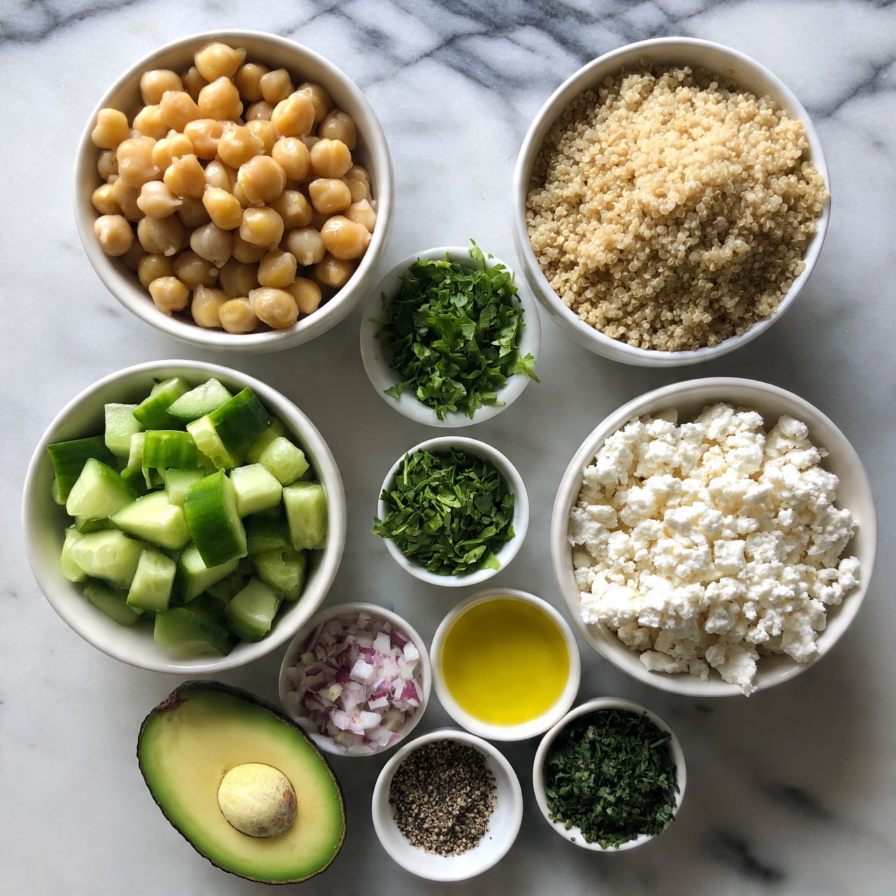 square image The image shows a top-down view of several small white bowls placed on a white marbled surface. There are five larger bowls and four smaller bowls arranged in a loose circle. Starting from the top left, one large bowl is filled with light golden chickpeas, and next to it on the right is another large bowl filled with fluffy beige quinoa. Below the chickpeas is a large bowl with chunks of bright green cucumber, and below the quinoa is a smaller bowl filled with finely chopped bright green parsley. To the right of the parsley is a large bowl filled with crumbled white cheese. Underneath these are three small bowls: one with a mix of chopped red and white onion, one with a yellow olive oil liquid, and one with finely chopped dark green herbs. There is also half of a ripe avocado with its pit in front of the onion bowl. In the middle at the bottom is a small bowl with black pepper. The colors are fresh and bright, with contrasting textures of smooth, crumbly, and chopped ingredients. photo taken with an iphone --ar 4:5 --v 7
