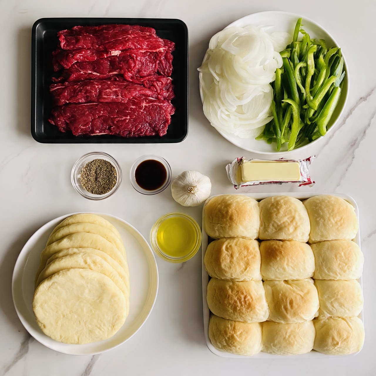 square image The image shows ingredients arranged neatly on a white marbled surface, including a black tray with thin red slices of raw meat at the top left, a white plate with sliced white onions and green bell pepper strips side by side at the top right, a small clear bowl with seasoning mix next to a small dish of dark sauce in the middle, a whole garlic bulb below in the center, a stick of butter wrapped in paper to the right, a small clear bowl with yellow oil below the garlic, a white plate stacked with round, pale yellow dough circles at the bottom left, and a white tray filled with soft, golden-brown dinner rolls at the bottom right photo taken with an iphone --ar 4:5 --v 7square image