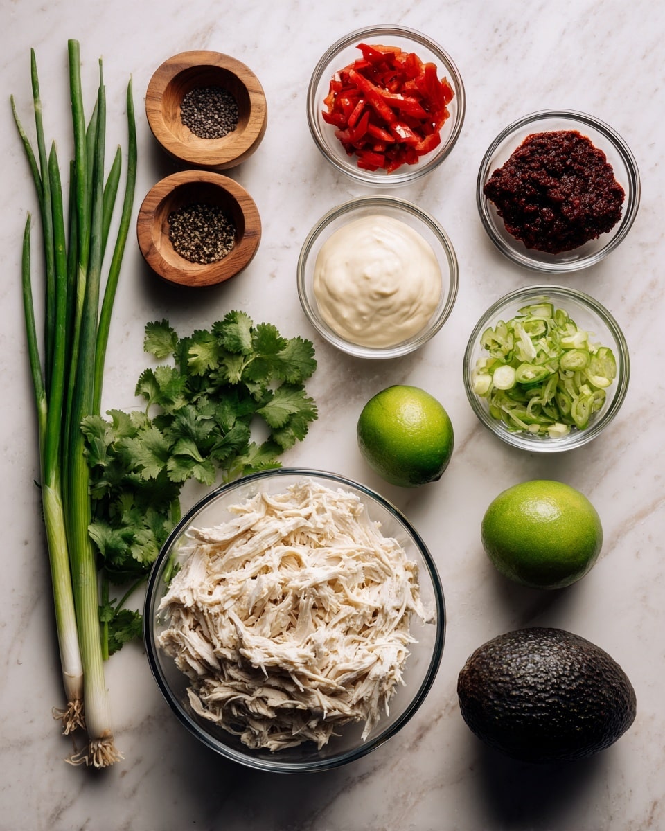 A white marbled surface holds fresh ingredients arranged neatly: a small bunch of green cilantro leaves at the bottom left, three long green onions above it, and a green lime next to the onions. To the right is a dark green avocado placed beside a clear glass bowl filled with shredded white chicken. Above the chicken, three small clear glass bowls contain creamy white sauces, chopped red bell peppers, and a dark red chili paste. Two small wooden bowls are at the top left with black pepper and salt. Photo taken with an iphone --ar 4:5 --v 7