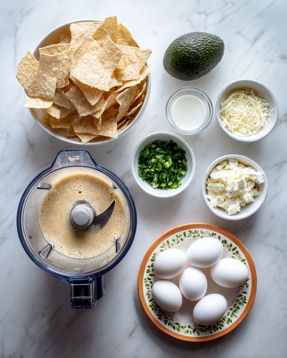 The image shows an overhead view of various food ingredients on a white marbled surface. At the center is a blender filled with a light brown, frothy liquid, with visible blade arms inside. Above the blender is a white bowl filled with enough tortilla chips stacked in loose layers, beige in color with a rough texture. To the left of the chips is a whole avocado, dark green and bumpy. Below the avocado, a small white bowl contains chopped green herbs. On the right of the blender, three small white bowls hold, from top to bottom, chopped white onions, crumbled white cheese, and a small amount of cream or milk in a clear measuring cup. At the bottom of the image is a round orange plate with a decorative white and green pattern along the edges, holding four white eggs spaced evenly and a small white bowl in the center with chopped red onions. The photo taken with an iphone --ar 4:5 --v 7
