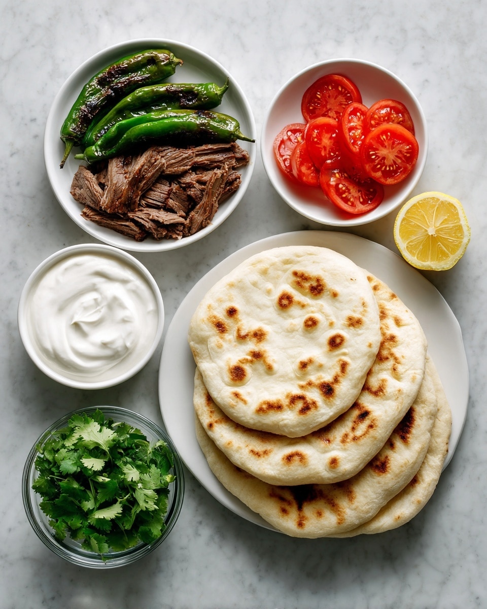 A white plate with two round, lightly browned pita breads stacked on the right side, showing a soft, slightly puffy texture. Above the plate, a small white bowl holds grilled green peppers with dark char marks. To the left of the peppers, another small white bowl is filled with thick white sauce, smooth in texture. Next to the sauce bowl is a third white bowl with bright red tomato slices, thin and juicy. Below these bowls, a clear glass bowl contains fresh, green cilantro leaves with visible stems. On the left side, a white bowl is filled with many thin slices of dark brown, crispy meat. A halved lemon with a bright yellow color rests between the meat and the tomato bowl. The whole setup is on a white marbled surface. Photo taken with an iphone --ar 4:5 --v 7