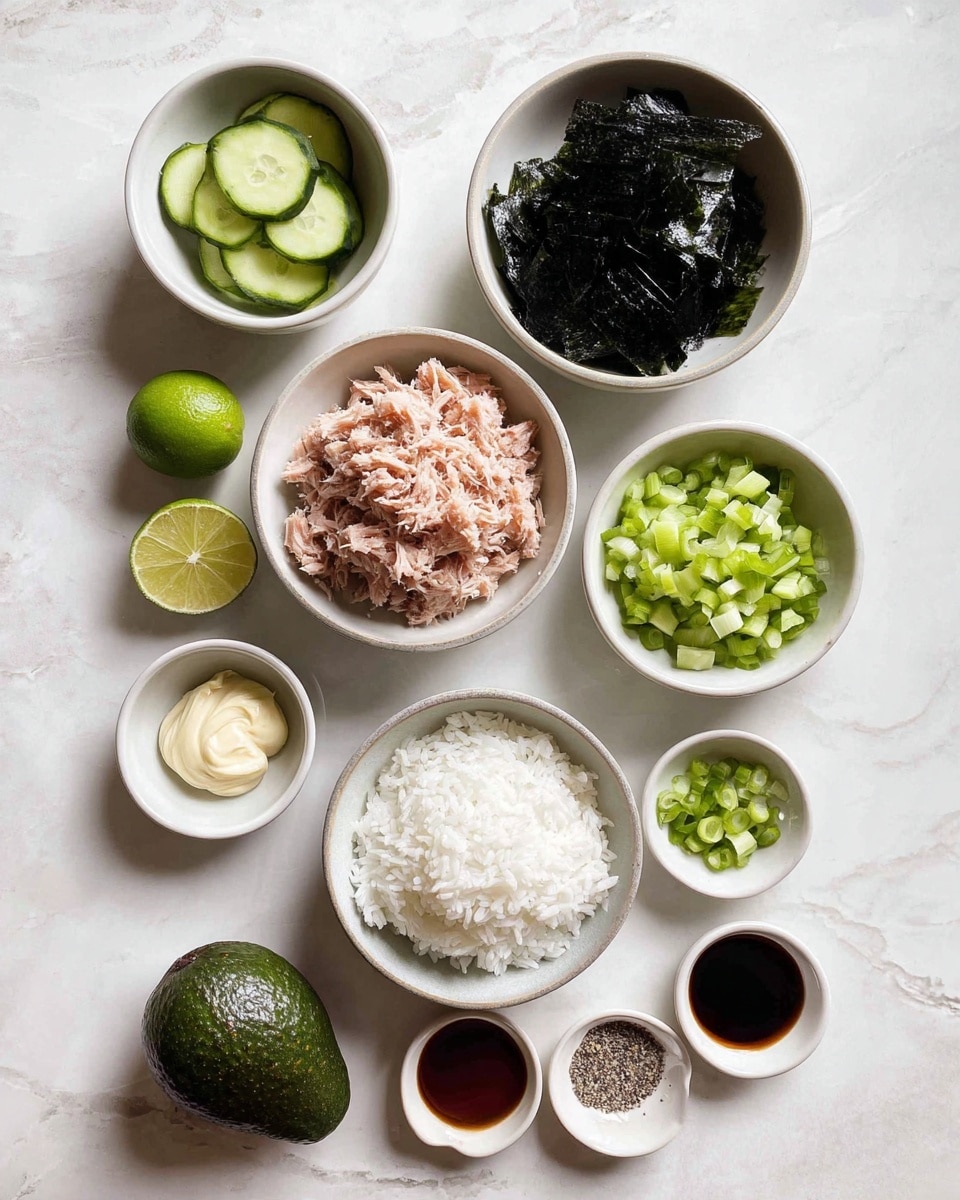 The image shows a collection of small white bowls arranged neatly on a white marbled surface, each holding different ingredients. Starting from top right, there is a bowl with dark green seaweed sheets, below it a large bowl filled with shredded light brown tuna, and next to it a bowl with small chopped green cucumber pieces. Centered below the tuna bowl is a bowl filled with white sticky rice. Around these are smaller bowls containing white and black seasonings, pale yellow mayonnaise, light beige sesame seeds, a dark soy sauce, and pale pink pickled ginger slices. At the bottom left sits a whole dark green avocado, and a small bowl of diced pale green scallions. A fresh green lime is placed near the scallions. The arrangement is tidy and minimalist with the textures varying from soft and wet, like the rice and tuna, to dry and crisp, like the seaweed sheets and seasonings. photo taken with an iphone --ar 4:5 --v 7