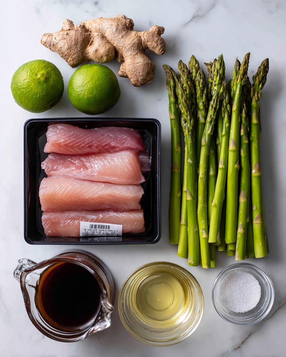 The image shows six ingredients arranged neatly on a white marbled surface. Starting from the left, there is a whole green lime and a fresh piece of ginger with a light brown rough skin. Below them is a black plastic tray holding raw pink fish fillets with a label on it. To the right of the tray is a bundle of fresh green asparagus spears standing upright. Above the asparagus is a small clear glass bowl filled with white granulated powder. Below this bowl is a glass measuring cup containing pale yellow liquid. Finally, to the left of the lime is a small glass pitcher with dark brown sauce. The overall setup is clean and bright, with all items clearly visible. photo taken with an iphone --ar 4:5 --v 7