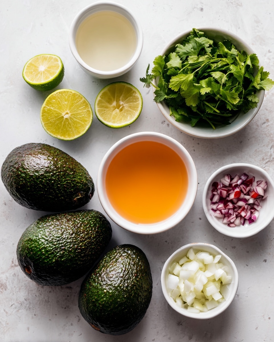 The image shows three dark green avocados with rough skin placed on a white marbled surface. Above them, from left to right, there is a white bowl filled with light orange liquid, a small white bowl with a clear liquid, a white bowl with fresh green cilantro leaves, a whole green lime, a white bowl with diced white onions, and a small white dish containing chopped red pieces and minced light tan garlic, all arranged neatly. photo taken with an iphone --ar 4:5 --v 7