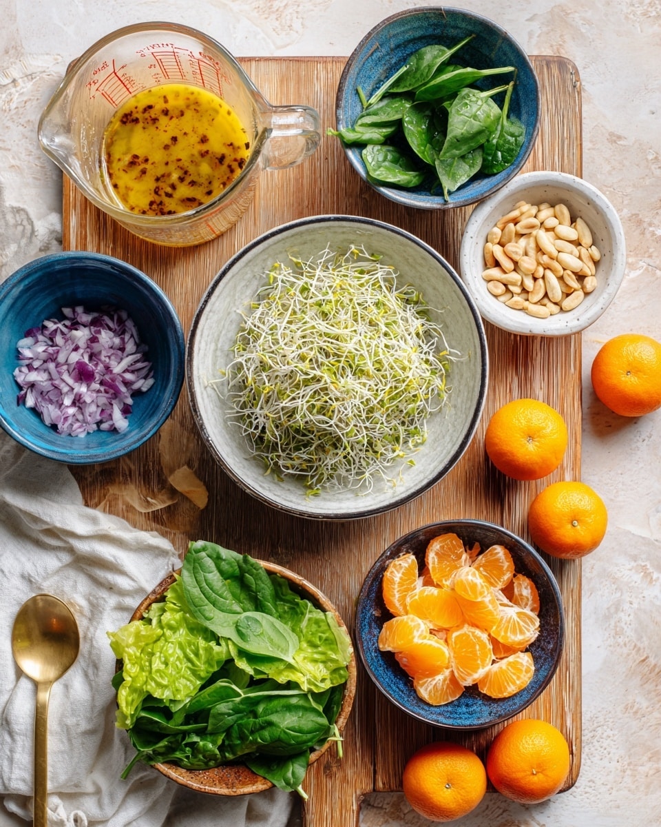 A top view of various salad ingredients arranged neatly on a light wooden board over a white marbled surface. In the center is a white bowl with a black rim filled with light, thin alfalfa sprouts. To the top right, a white bowl holds small, pale pine nuts. Just below it, a bright blue bowl contains shiny, orange mandarin segments. At the top left, a tall glass measuring cup has a golden yellow dressing with visible red pepper specks. Next to it, a blue bowl is filled with fresh, dark green spinach leaves. In the bottom left corner, a blue bowl has finely chopped red onions. A golden spoon lies beside it with some dressing on it. Across the bottom, fresh green leaf lettuce rests on a white cloth. Three small orange tangerines are placed along the side of the wooden board. photo taken with an iphone --ar 4:5 --v 7