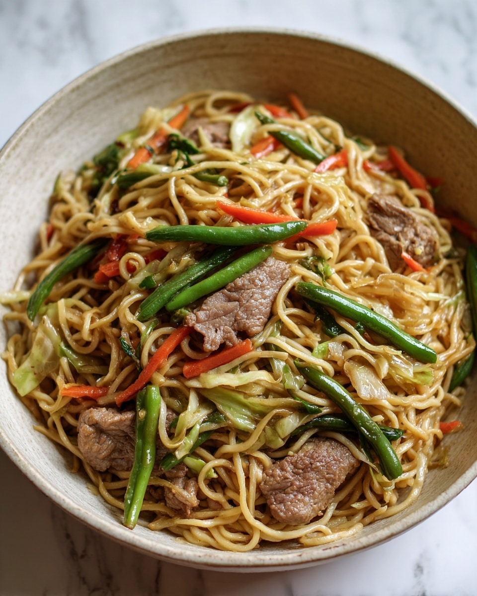 This close-up image shows a dish of stir-fried noodles mixed with several ingredients. The noodles are light brown and tangled together. Mixed among the noodles are pieces of cooked meat with a light brown, slightly shiny surface. There are bright green long beans placed on top, adding contrast. Thin strips of orange carrots and light-colored cabbage are spread throughout, adding texture and color. The dish looks warm and slightly oily, with a mix of soft and crisp vegetables. The arrangement is natural and slightly messy, showing a freshly cooked meal. The background is a white marbled texture. Photo taken with an iphone --ar 4:5 --v 7
