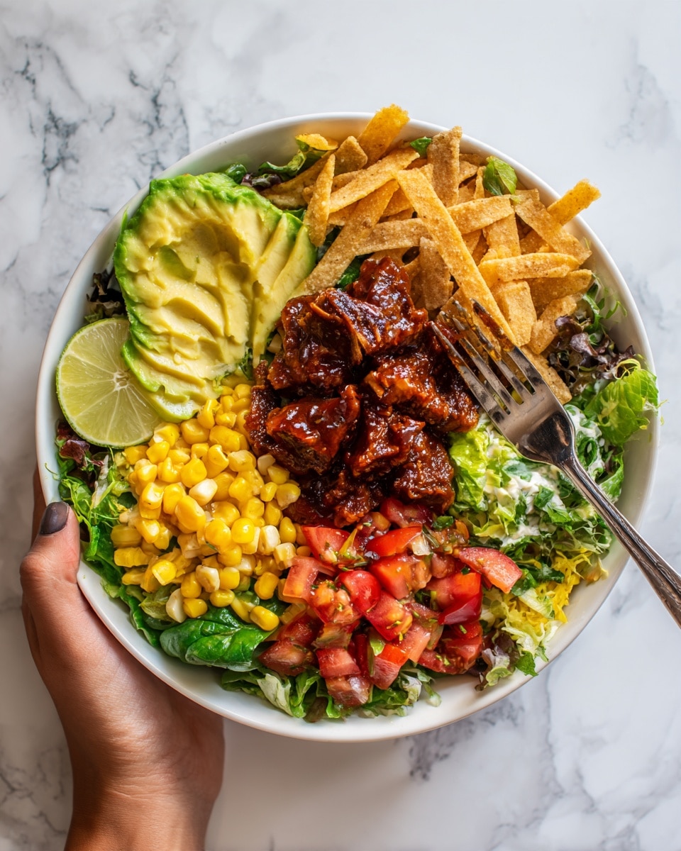 A white bowl filled with a colorful layered salad sits on a white marbled surface. The salad has a base of mixed green leafy vegetables, topped with diced red tomatoes and diced yellow corn. There are chunks of sliced avocado on one side, and strips of crispy light brown fried tortilla pieces scattered on top. In the center, there is a serving of dark brown grilled or roasted meat covered with a shiny reddish-brown sauce. A pale yellow lime wedge rests on the edge of the bowl. A woman's hand is holding a fork above the bowl. Photo taken with an iphone --ar 4:5 --v 7